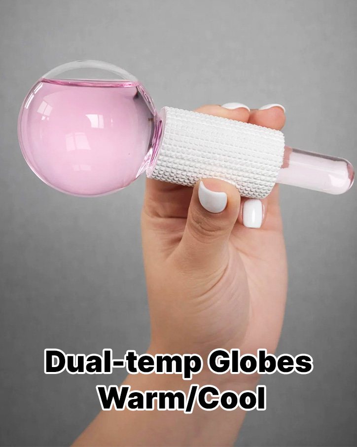 Hand holding a pink glass globe labeled dual-temp warm and cool