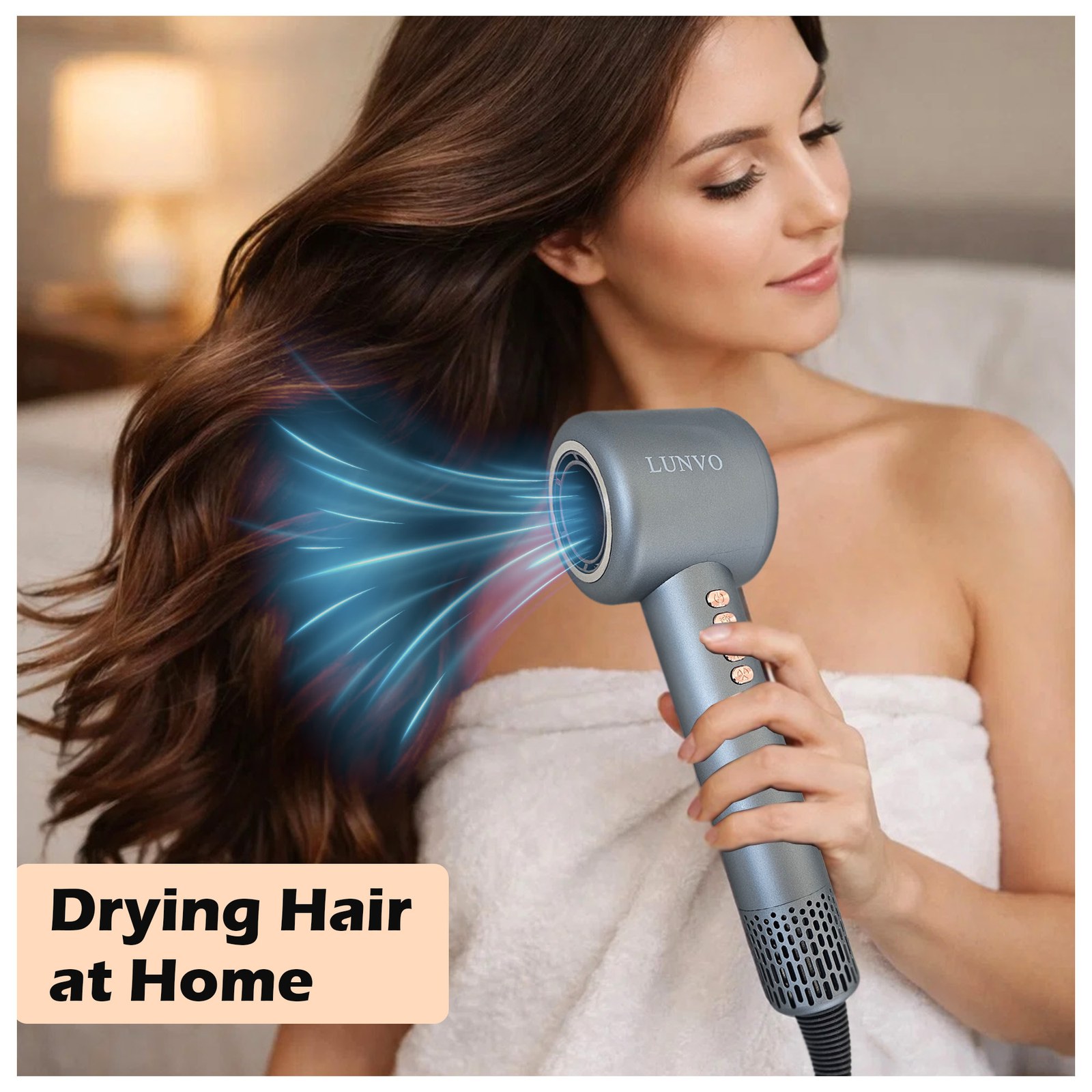 Woman wrapped in a towel drying her long brown hair with the LUNVO dryer