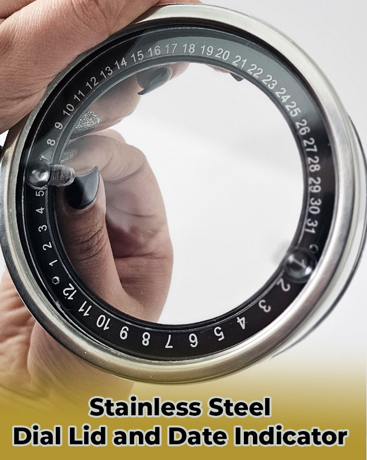 Close-up of a hand holding the stainless steel dial lid with date numbers 1 to 31