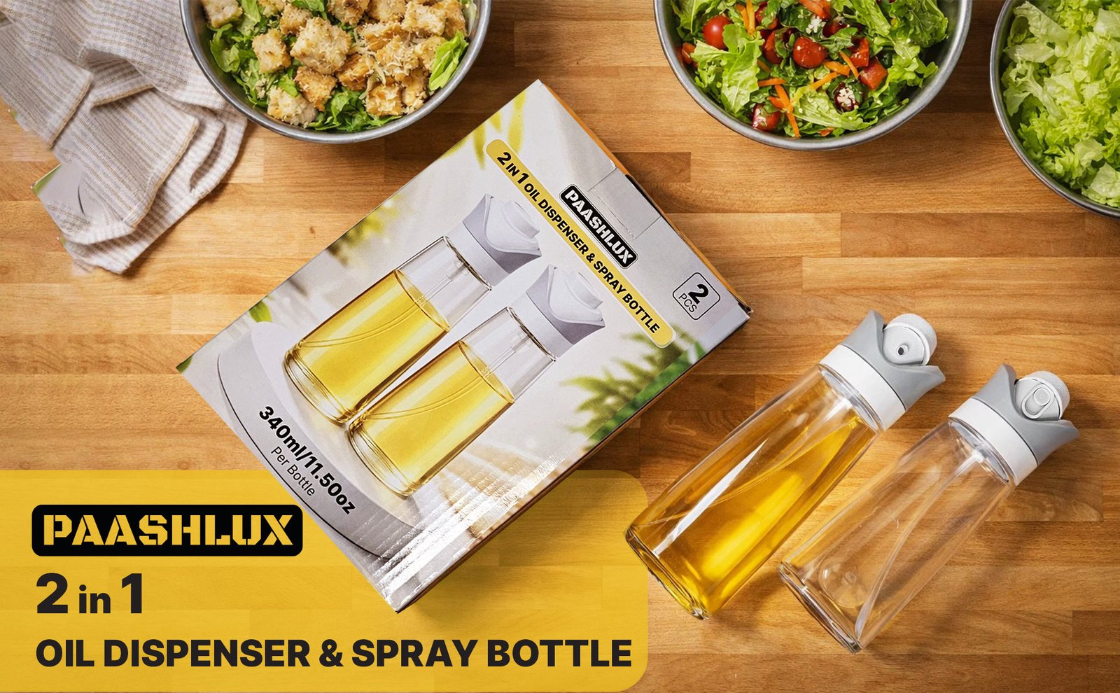 Boxed PAASHLUX oil dispenser set and two bottles on a wooden board with salad bowls