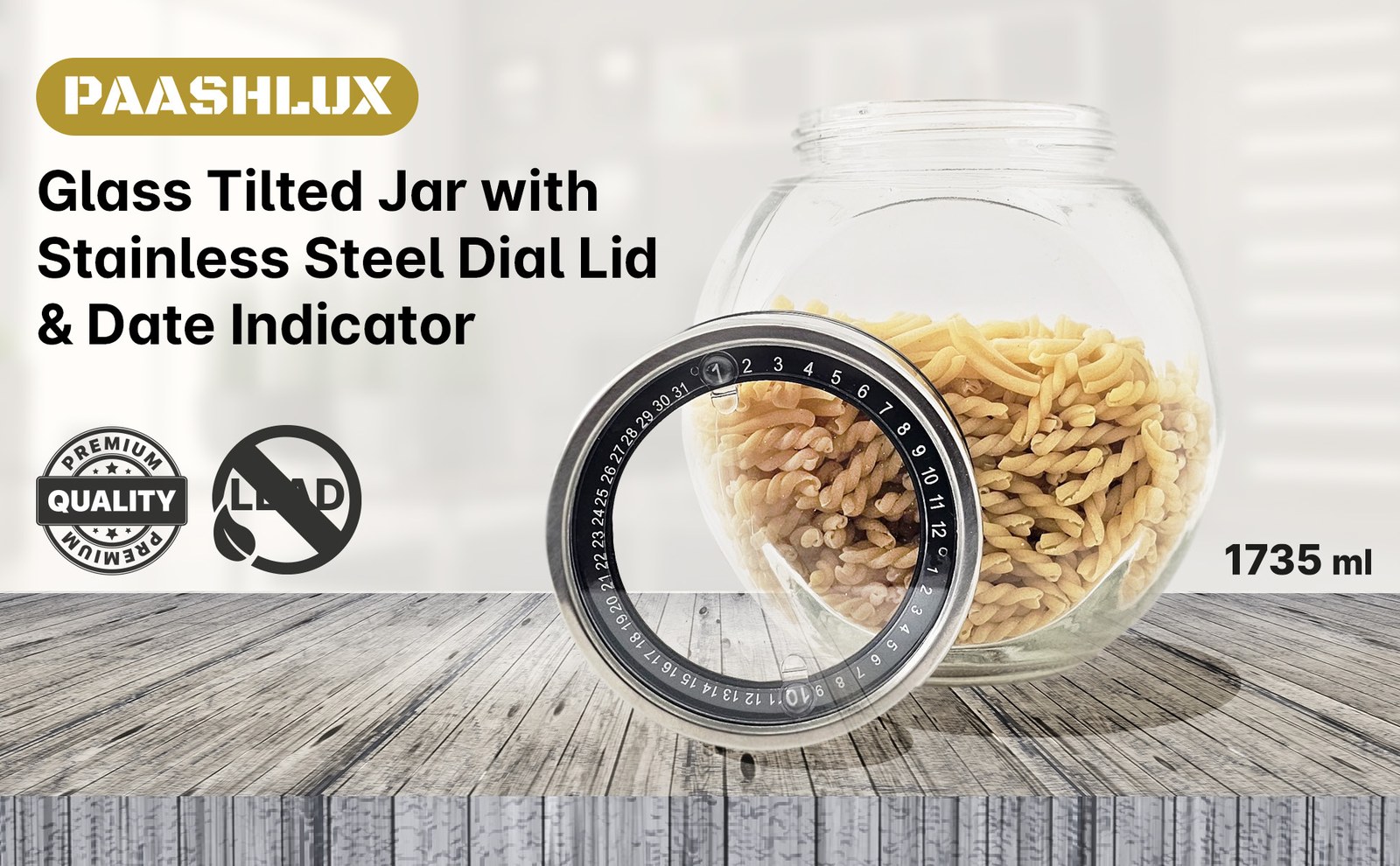 Glass tilted jar of pasta with the stainless steel dial lid in front on a grey wood counter