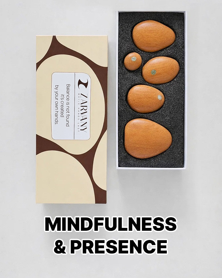 Five wooden stones in an open black box beside the cream box, labeled Mindfulness and Presence