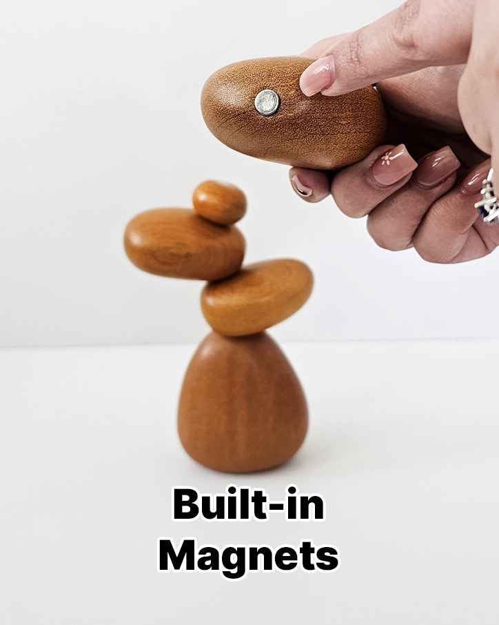 A hand holding a wooden stone with a magnet above a small stack, labeled Built-in Magnets