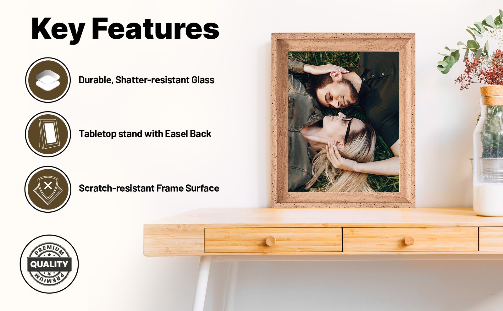 Brown Zibrro frame on a light wood console table with three feature icons: shatter-resistant glass, tabletop stand with easel back, scratch-resistant surface