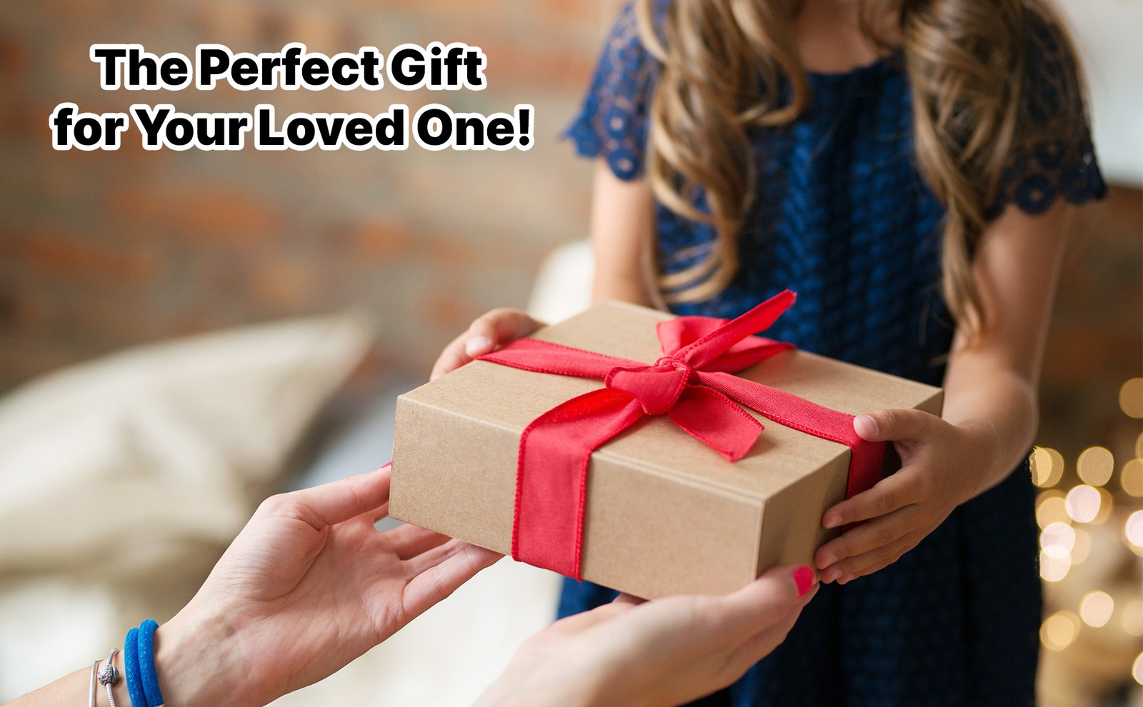 Hands passing a wrapped gift box tied with a red ribbon, with the headline The Perfect Gift for Your Loved One