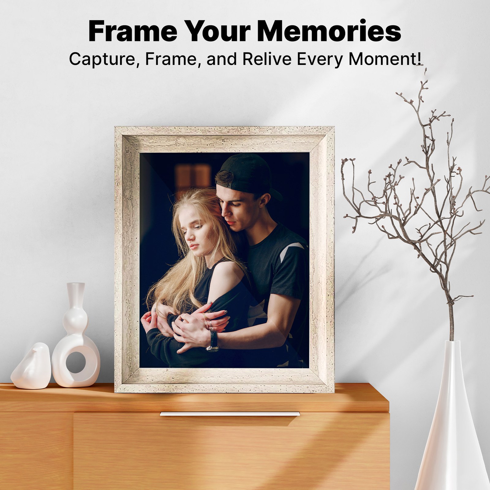 Zibrro frame holding a couple portrait on a wooden console beside white vases and a branch, with the headline Frame Your Memories